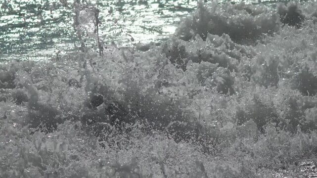 Dramatic Crashing Icy Waves Splashing Over Frozen Winter Shoreline Vertical video