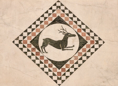 LUCCA, ITALY - JUNE 23, 2026: The detail of medieval marble intarsia (deer) of church Cattedrale di San Martino by unknown artist (1210 &ndash; 1230). 