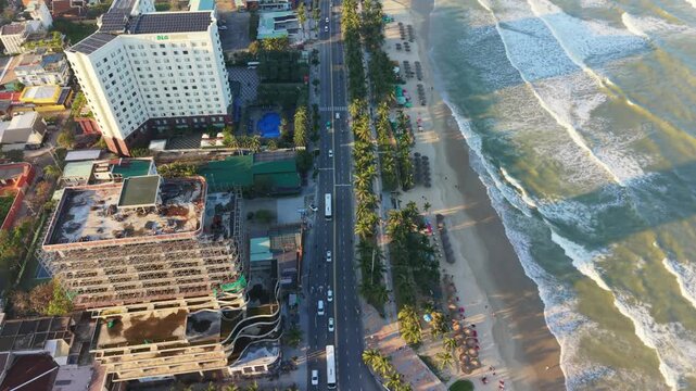 Vietnam, Da Nang Seaside Boulevard With Lively Streets. Beachfront Scene Featuring Hotels And Busy Traffic. Scenic Coastal Avenue With Crashing Waves And Bustling City Surroundings