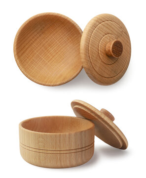 Set of a small bowl with a lid and a salt cellar on a white. Isolated