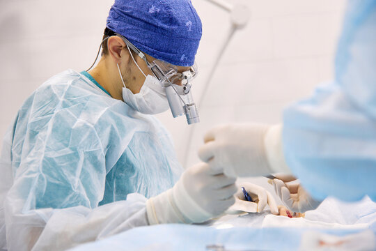 Doctors performing eye surgery on patient at hospital