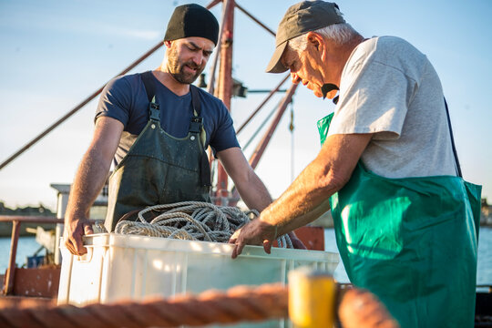 Fishermen working on trawler