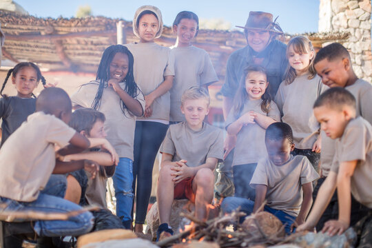Children learning how to make a fire