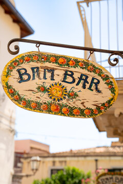 Taormina, Italy - 12 July 2026: Close-up of the hand-painted Bam Bar granita cafe sign decorated with oranges in historic centre of Taormina, Sicily