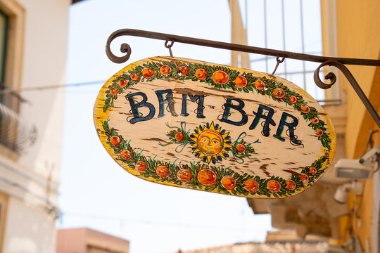 Taormina, Italy - 12 July 2026: Close-up of the hand-painted Bam Bar granita cafe sign decorated with oranges in historic centre of Taormina, Sicily