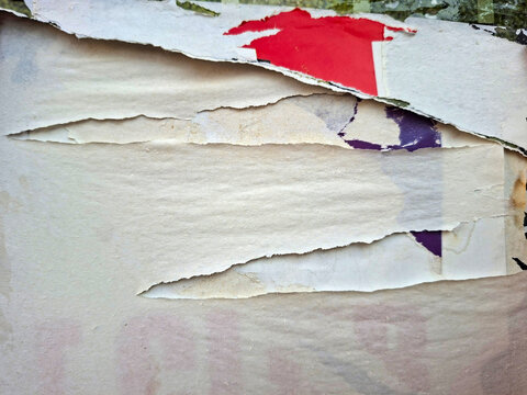 Torn and ripped urban textured paper poster grungy background