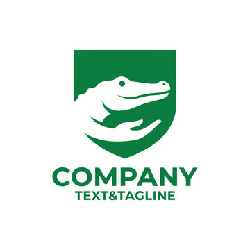 Green crocodile head shield logo icon.
