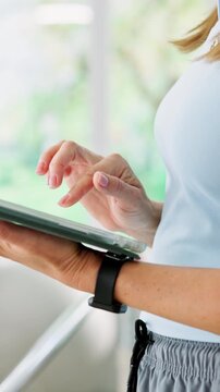 Woman, hands and physiotherapist with tablet in private practice for online research or schedule. Female person, practitioner or scrolling with technology for patient booking or planning routine