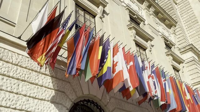 Flags of Many World Nations Displayed on Building