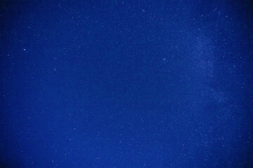 A starry night sky over central Mongolia, showcasing a vast expanse of deep blue with countless stars and a faint Milky Way. © JX