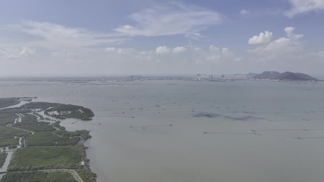 Aerial view of Ganh Rai Bay from Can Gio, Ho Chi Minh City to Vung Tau City, Ba Ria - Vung Tau Province, Vietnam, surrounded by busy marine traffic and cargo ships.