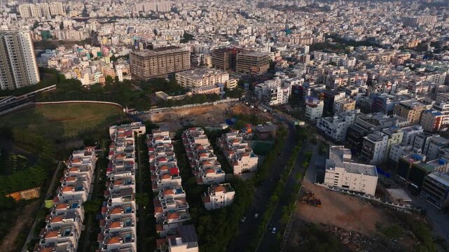 Aerial view of manikonda with villas, Residential houses, cricket ground and Marrichettu Junction at hyderabad, telangana, india. day time, static shot, drone shot, 4k.