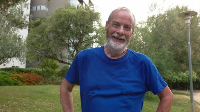 Happy senior man smiling after outdoor workout at the park
