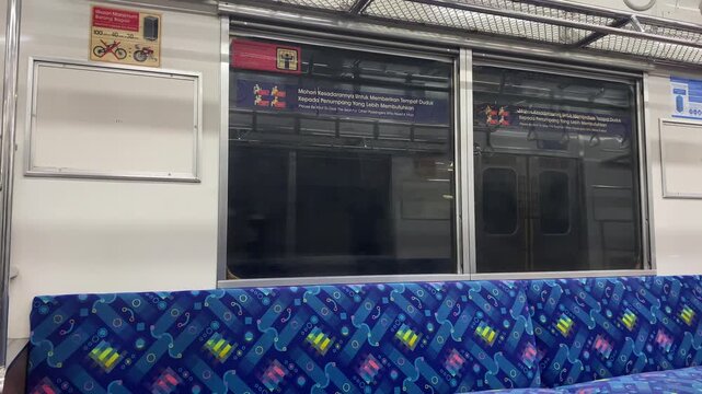 Empty Subway Train Interior with Patterned Blue Seats