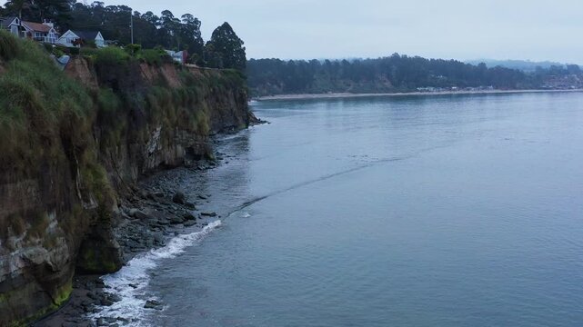 Aerial morning backward flight Capitola shore
