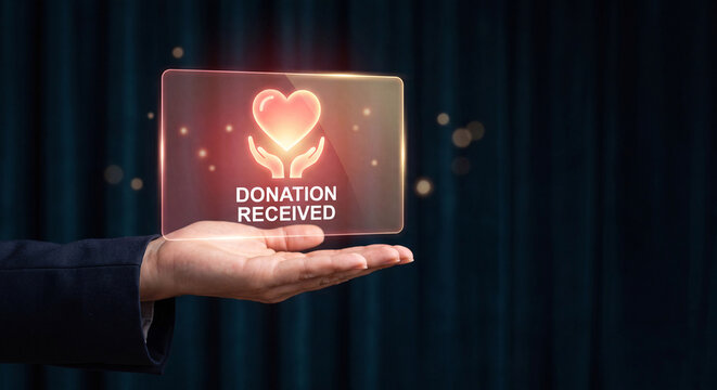 businesswoman holds glowing donation heart interface above palm to support charity fundraising campaign, track community outreach, verify nonprofit contribution