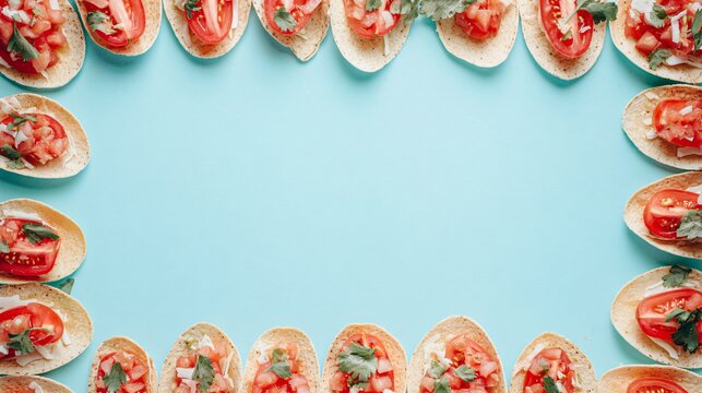 A bright breakfast arrangement with tostadas aligned along the borders of a pastel blue background leaving the center empty for text placement