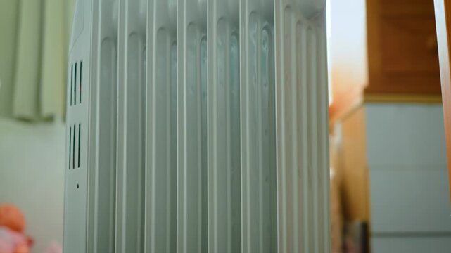 Closeup oil radiator sections storing and releasing heat. Electric heater design supporting silent operation and long lasting thermal retention. Sustainable home heating, energy efficiency, and