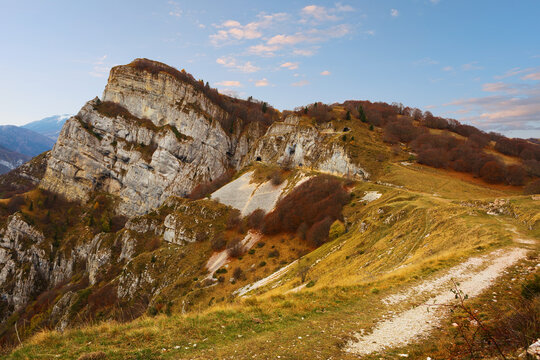 Hiking trail on the Sentiero della Pace (Peace Path)  in Brentonico in late autumn, Monte Baldo  mountain range, Trento, ItalyView on the Corno della Paura.