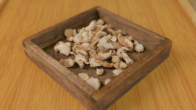 Dried galangal roots. Galangal is a commonly used spice to prepare flavorful dishes.