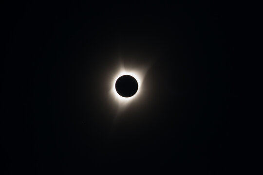total solar eclipse with celestial halo or corona during totality