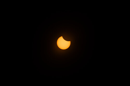 partial solar eclipse with crescent fase; sun covered partialy by the moon