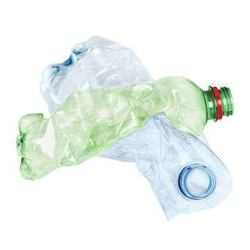 Crushed green and blue plastic bottles on transparent background.