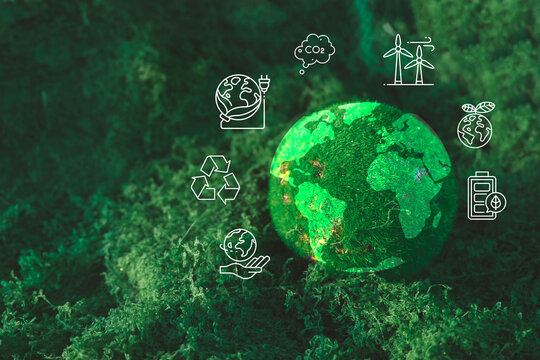 ESG and sustainability concept. Green moss globe on a natural moss background with white renewable energy and eco-friendly icons. Environmental protection and green business strategy.