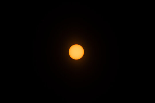 sun in the sky, during solar eclipse penumbra fase, waiting for totality