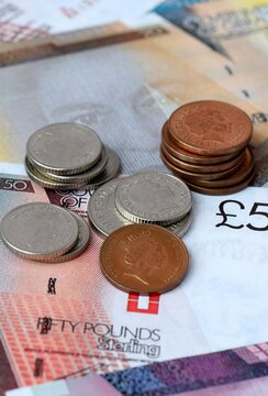 Gibraltar pound money banknotes and coins on table. Gibraltar cash bills of GIP currency