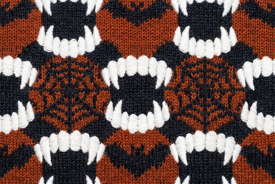 Halloween knitted wool texture with vampire's teeth