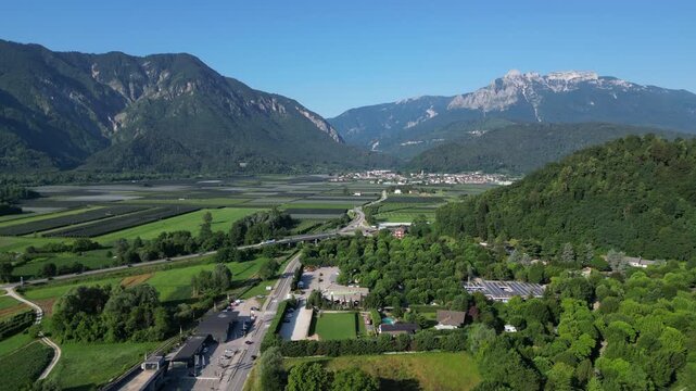 4K aerial drone footage showcasing the mountainous landscape surrounding Levico Terme in the Valsugana Valley, Trentino, northern Italy.