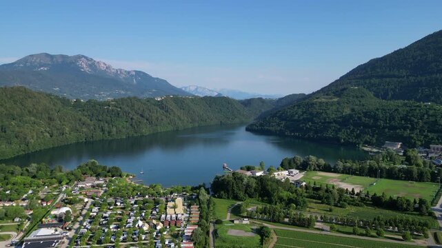 4K aerial drone footage showcasing the mountainous landscape surrounding Levico Terme in the Valsugana Valley, Trentino, northern Italy.