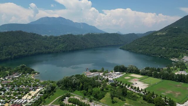 4K aerial drone footage showcasing the mountainous landscape surrounding Levico Terme in the Valsugana Valley, Trentino, northern Italy.