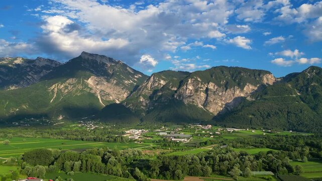 4K aerial drone footage showcasing the mountainous landscape surrounding Levico Terme in the Valsugana Valley, Trentino, northern Italy.