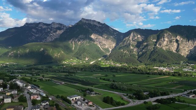 4K aerial drone footage showcasing the mountainous landscape surrounding Levico Terme in the Valsugana Valley, Trentino, northern Italy.