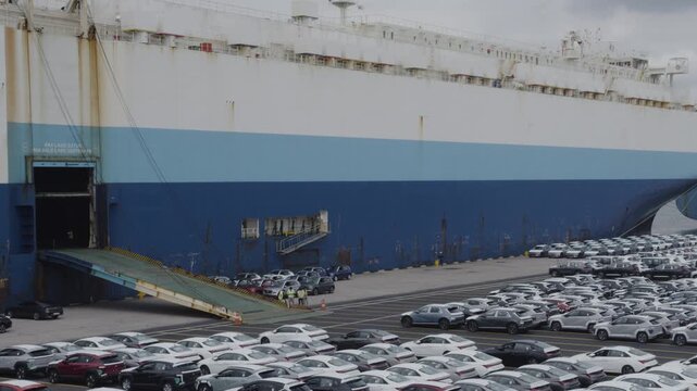 Timelapse of Cars Being Moved on to a Cargo Ship at a Korean Port
