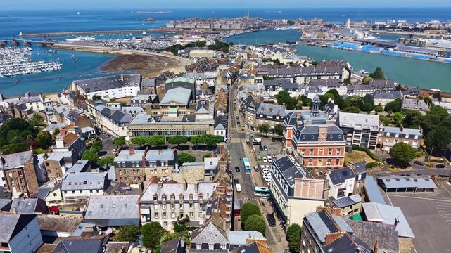 Rue Ville-P&eacute;pin crosses Saint-Servan toward Saint-Servan Town Hall, Bassin Bouvet, Port of Saint-Malo, Saint-Malo Intra-Muros on Rance Estuary in Ille-et-Vilaine, Brittany, France, drone lateral slide
