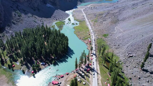 Campsites and cedar forest surround Saifullah Lake in Upper Ushu Valley, Khyber Pakhtunkhwa, Pakistan