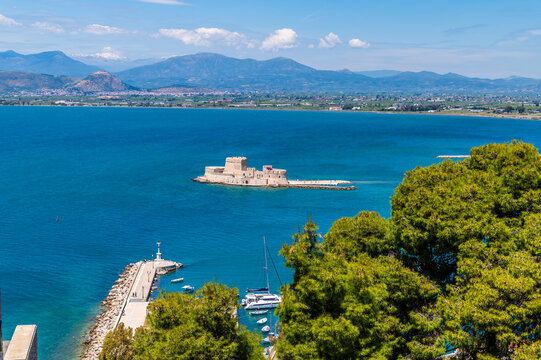 A view down from the Acronauplia, fortress towards the Bourtzi Castle in Nafplio in Greece in early summertime
