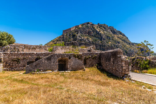 A view across the Acronauplia, fortress up with a backdrop of the Palamidi fortress above the old town in Nafplio in Greece in early summertime