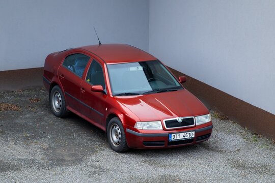 Red Skoda Octavia liftback car after facelift parked on street