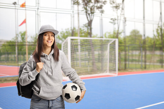 Female student holding a football