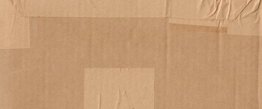 Frame made of brown beige old paper with packet tape, cardboard carton packaging pattern texture background banner panorama