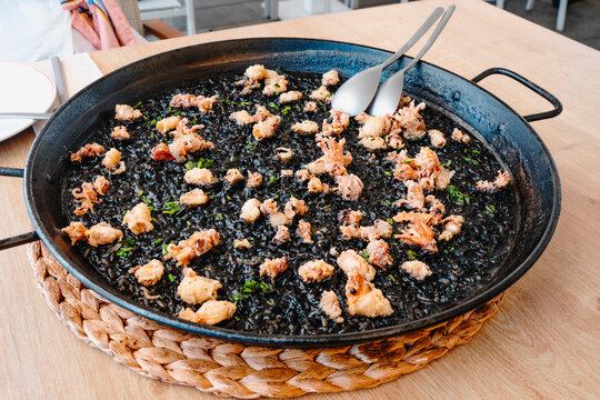 spanish arros negre with chipirones a la andaluza