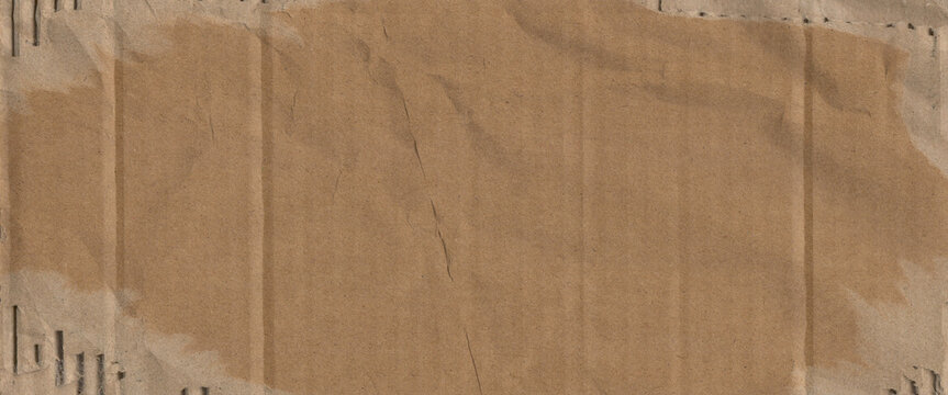 Frame made of brown beige old damaged torn paper, cardboard pattern texture background banner panorama