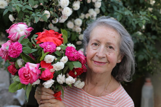 Stunning mature lady with flowers 