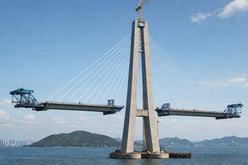 Obraz premium Cable Stayed Bridge Rising Over Coastal Waters