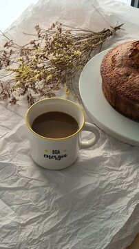 Fresh homemade cake served with a cup of coffee, perfect for breakfast or an afternoon snack. Warm, comforting and inviting homemade food concept.