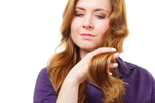 Woman with long hair shows healthy ends